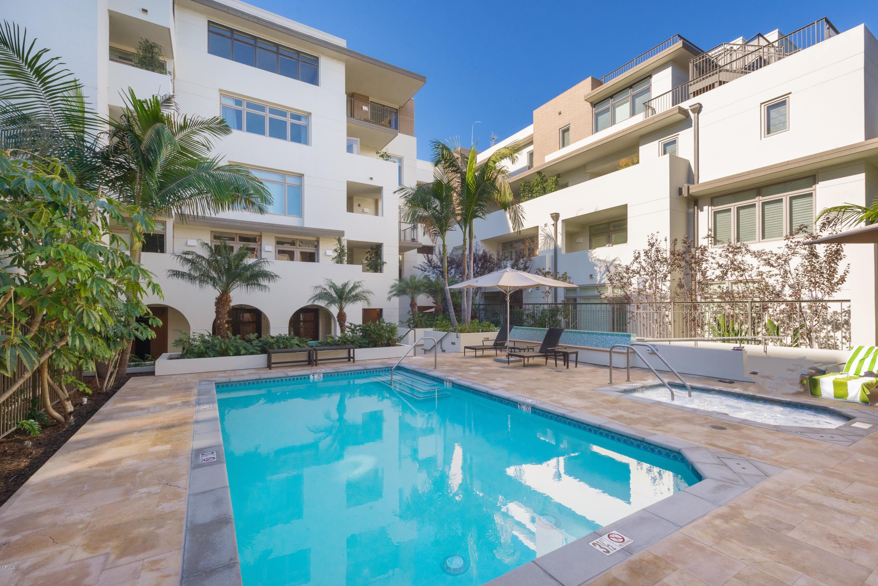 920 Granite Drive, Unit 509 Pasadena, CA 91101 - Photo 25 of 26 a view of a swimming pool with a patio