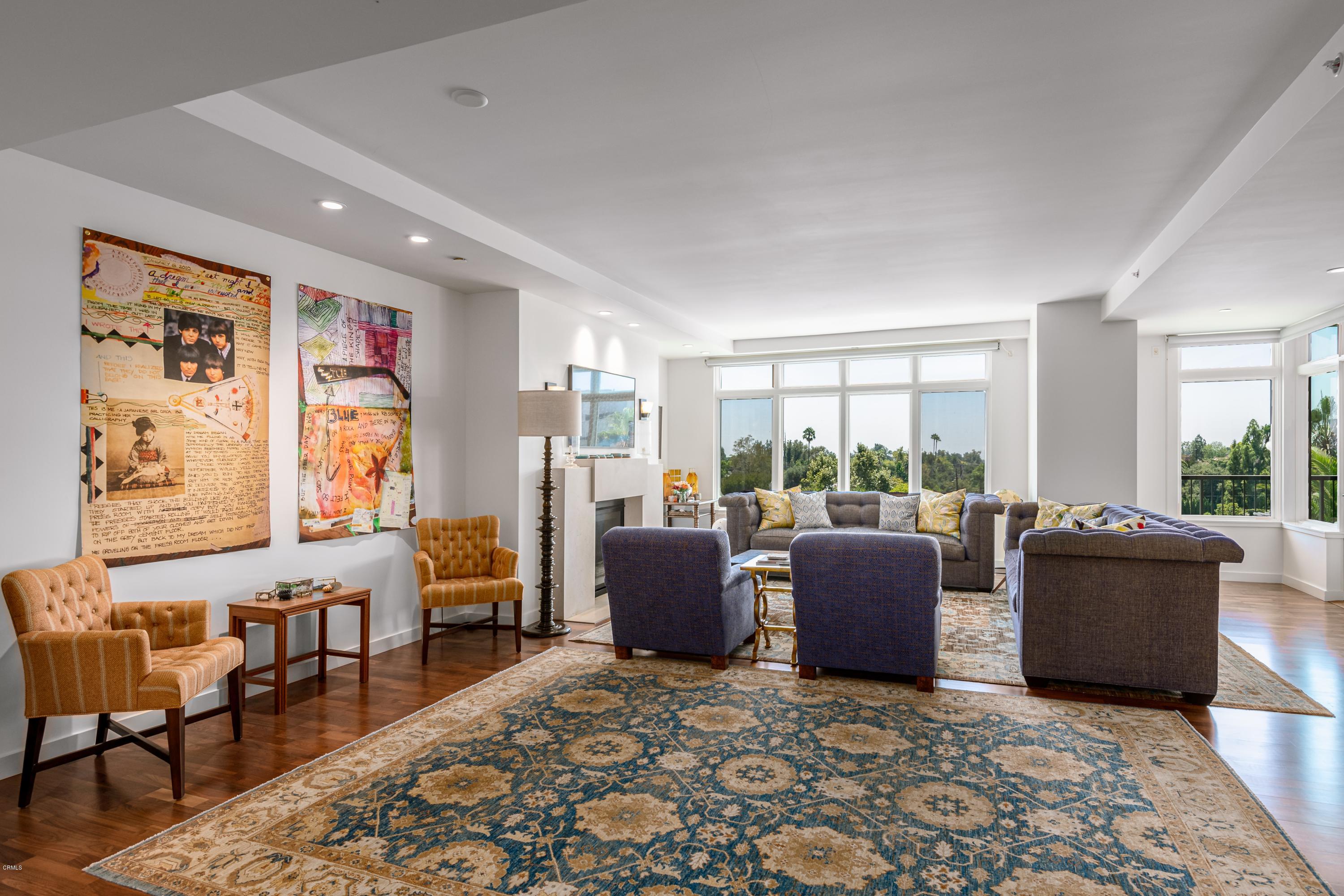 920 Granite Drive, Unit 509 Pasadena, CA 91101 - Photo 4 of 26 a living room with furniture and large windows