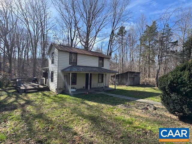4473 Old Sand Road Schuyler, VA 22969 - Photo 2 of 10 a view of a house with a yard and a large tree