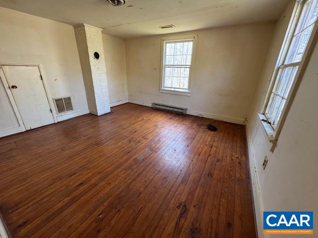4473 Old Sand Road Schuyler, VA 22969 - Photo 4 of 10 an empty room with wooden floor and windows