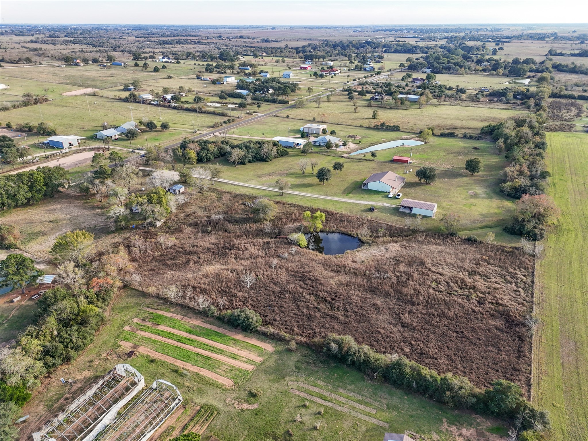 19703 Frey Road Pine Island, TX 77445 - Photo 8 of 18 an aerial view of residential houses with outdoor space and river