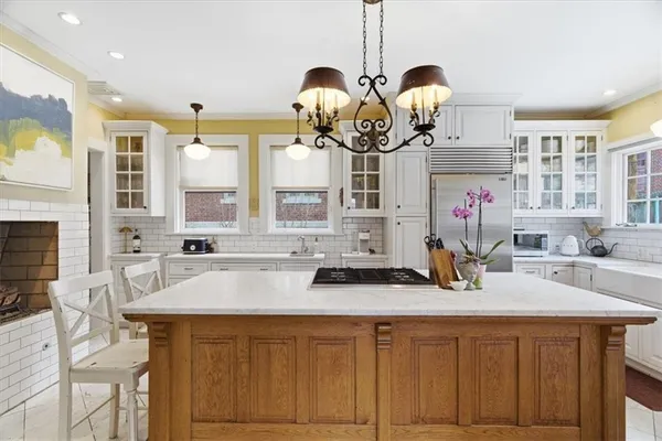 a kitchen with stainless steel appliances a sink a stove and a counter space
