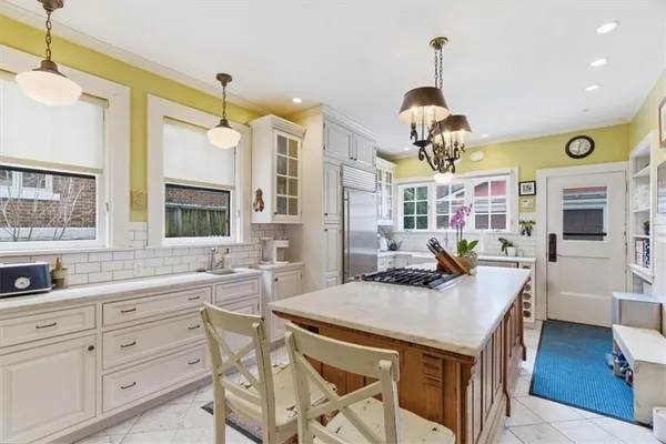 a kitchen with a sink stove and cabinets