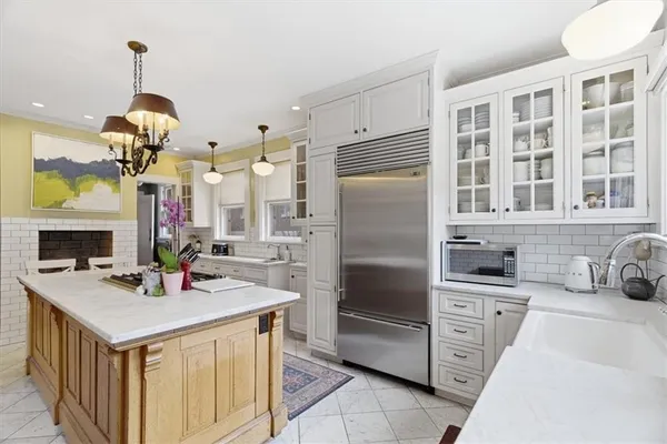 a bathroom with a toilet a sink and a mirror