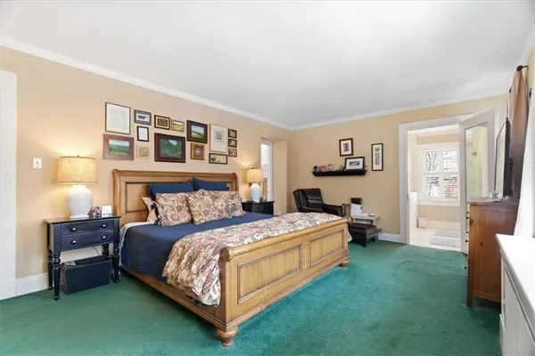 a spacious bathroom with a granite countertop sink a large mirror and a shower