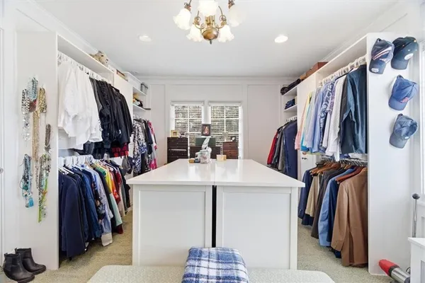 a kitchen with a sink a stove and cabinets