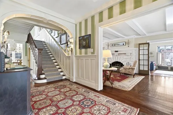 a view of an entryway with wooden floor