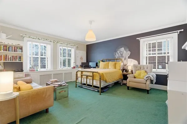 a bed room with a bed and a window