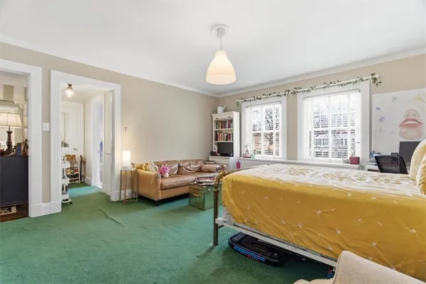 a bathroom with a toilet a sink and a mirror