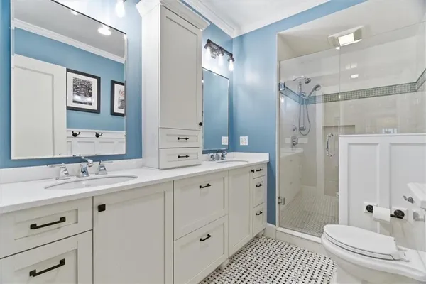 a very nice looking room with many windows and a dining table