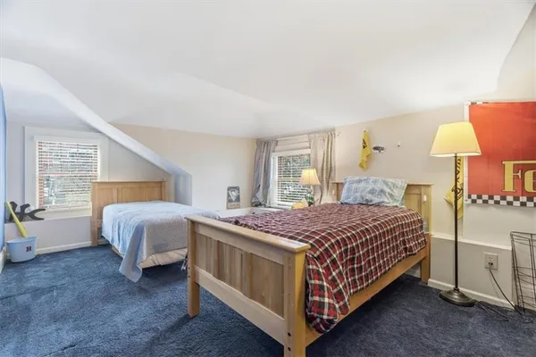 a view of a workspace with furniture and a flat screen tv