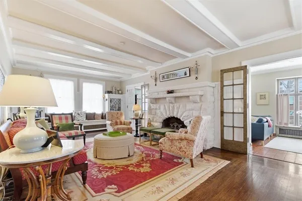 a living room with furniture and a fireplace