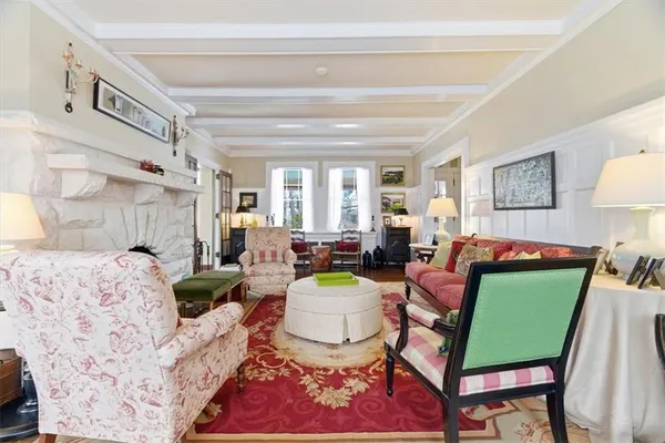 a living room with furniture and a lamp