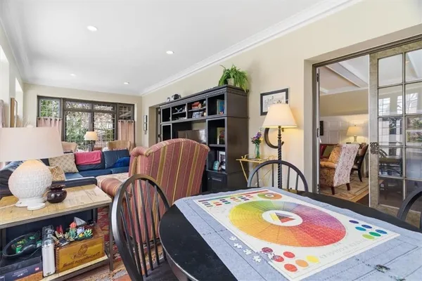 a room with furniture a rug and a flat screen tv