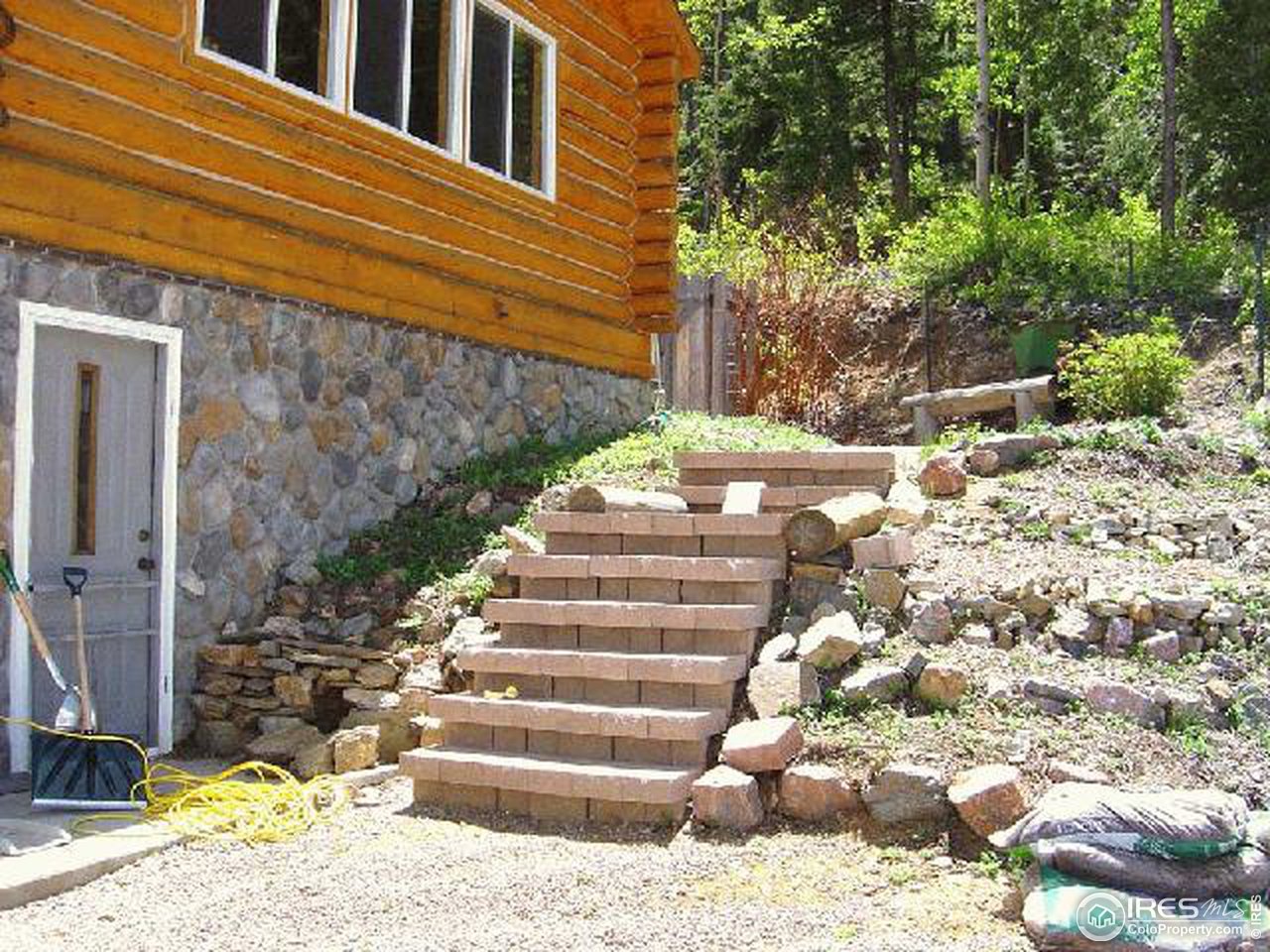 15855 Rist Canyon Road Bellvue, CO 80512 - Photo 10 of 12 a view of a pathway of a house with a yard