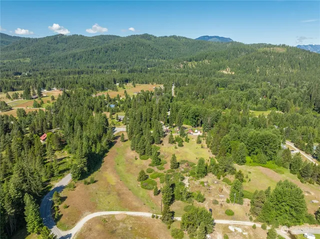 a view of a backyard of a house