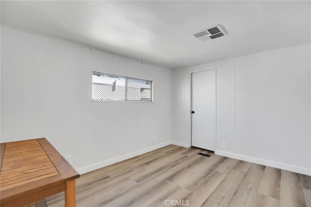 840 Foothill, Unit 27 Azusa, CA 91702 - Photo 21 of 30 a view of empty room with wooden floor and fan
