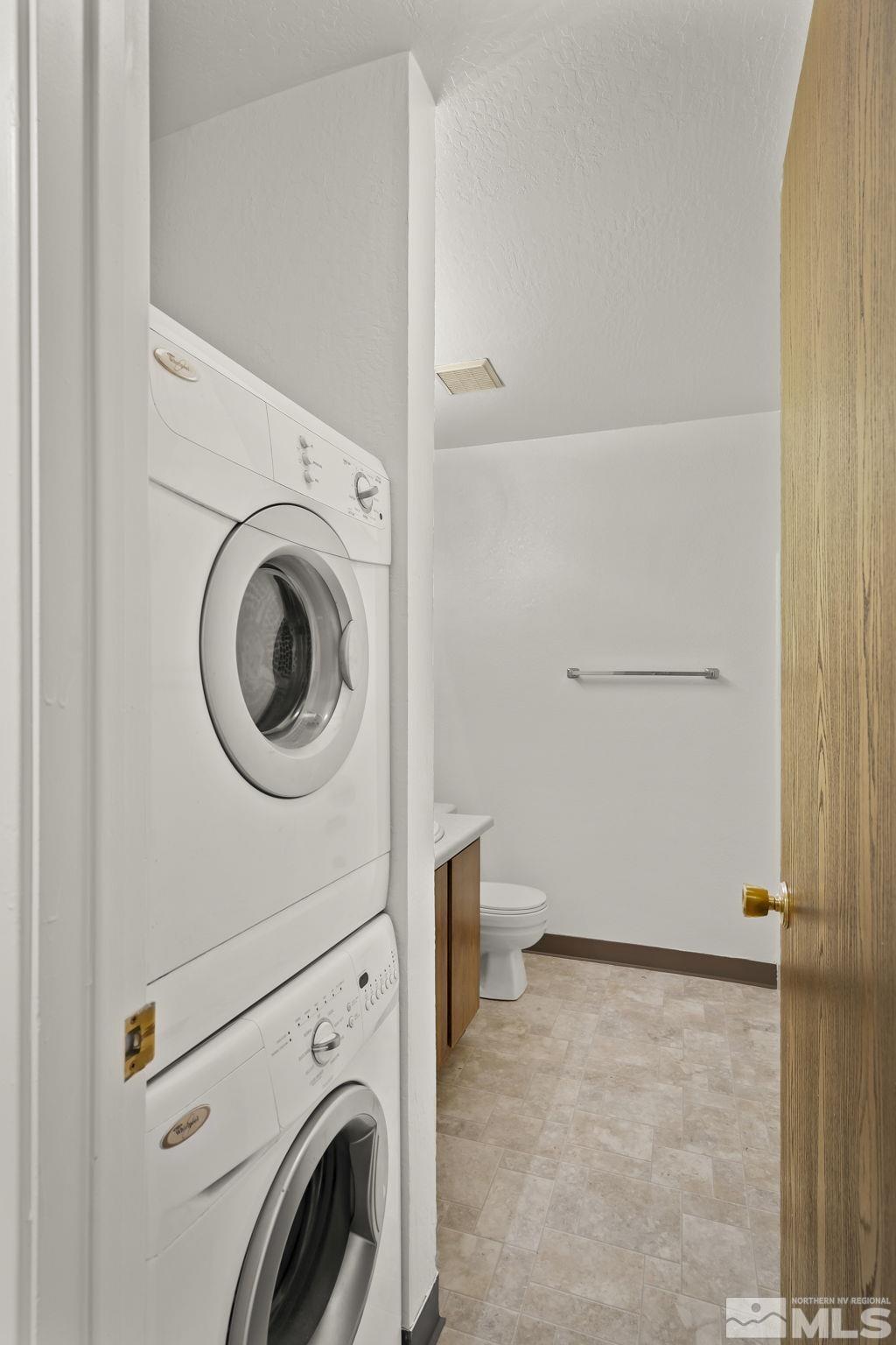 4893 Reggie Road Reno, NV 89502 - Photo 14 of 27 a view of a storage & utility room with washer and dryer