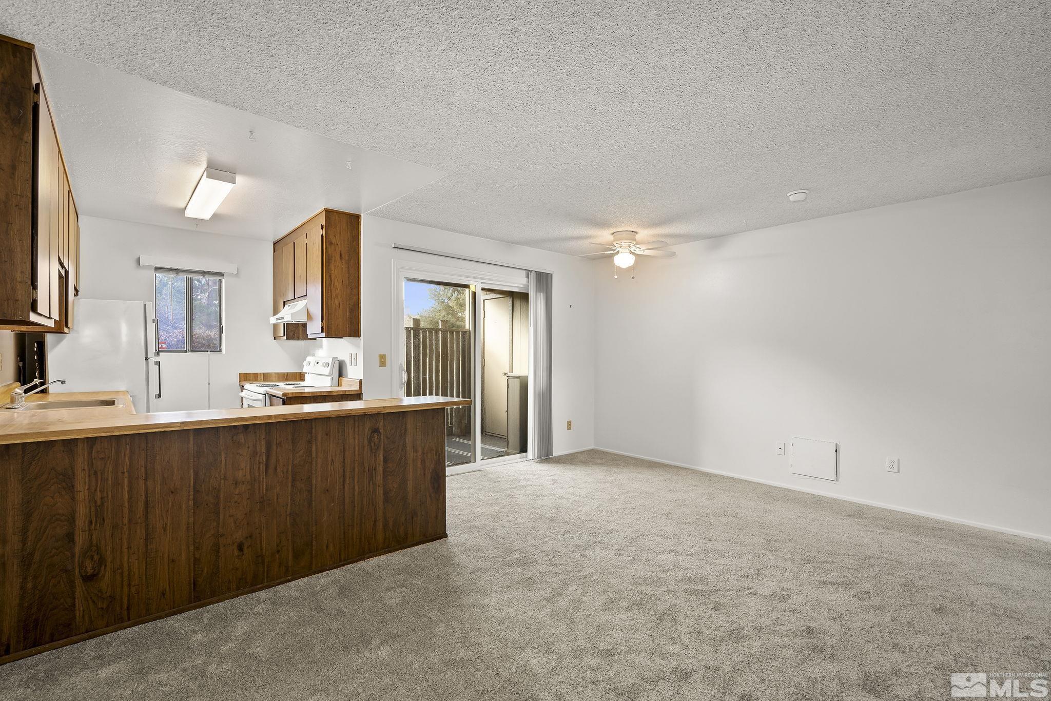 4893 Reggie Road Reno, NV 89502 - Photo 5 of 27 a view of a kitchen with a sink