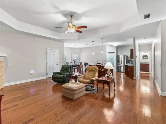 a room with a chandelier and living room view