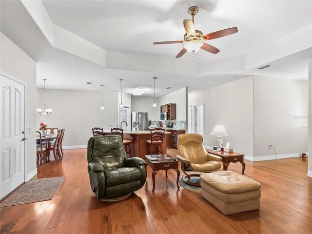 a bedroom with a bed dresser and a flat tv screen