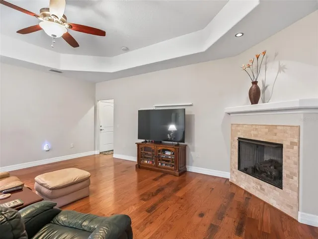 a bedroom with a bed window and dresser