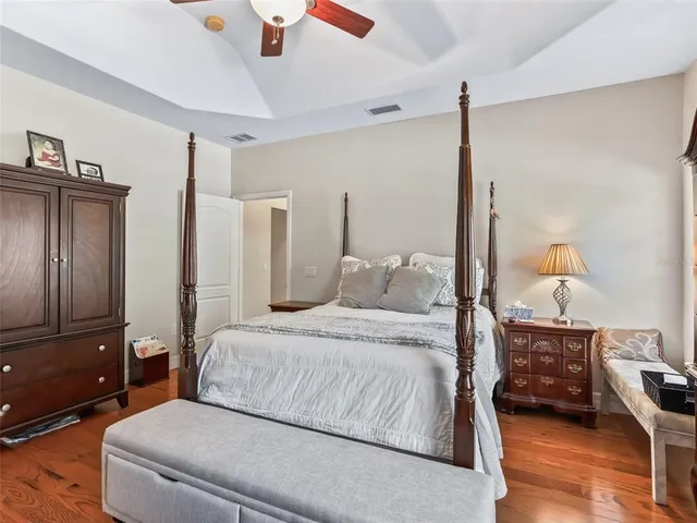 a living room with furniture ceiling fan and a window