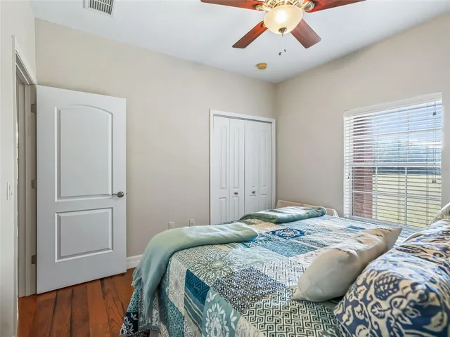 a building outdoor space with patio furniture and potted plants