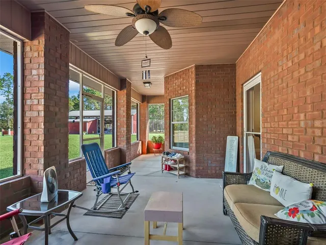an aerial view of a residential houses with outdoor space and street view