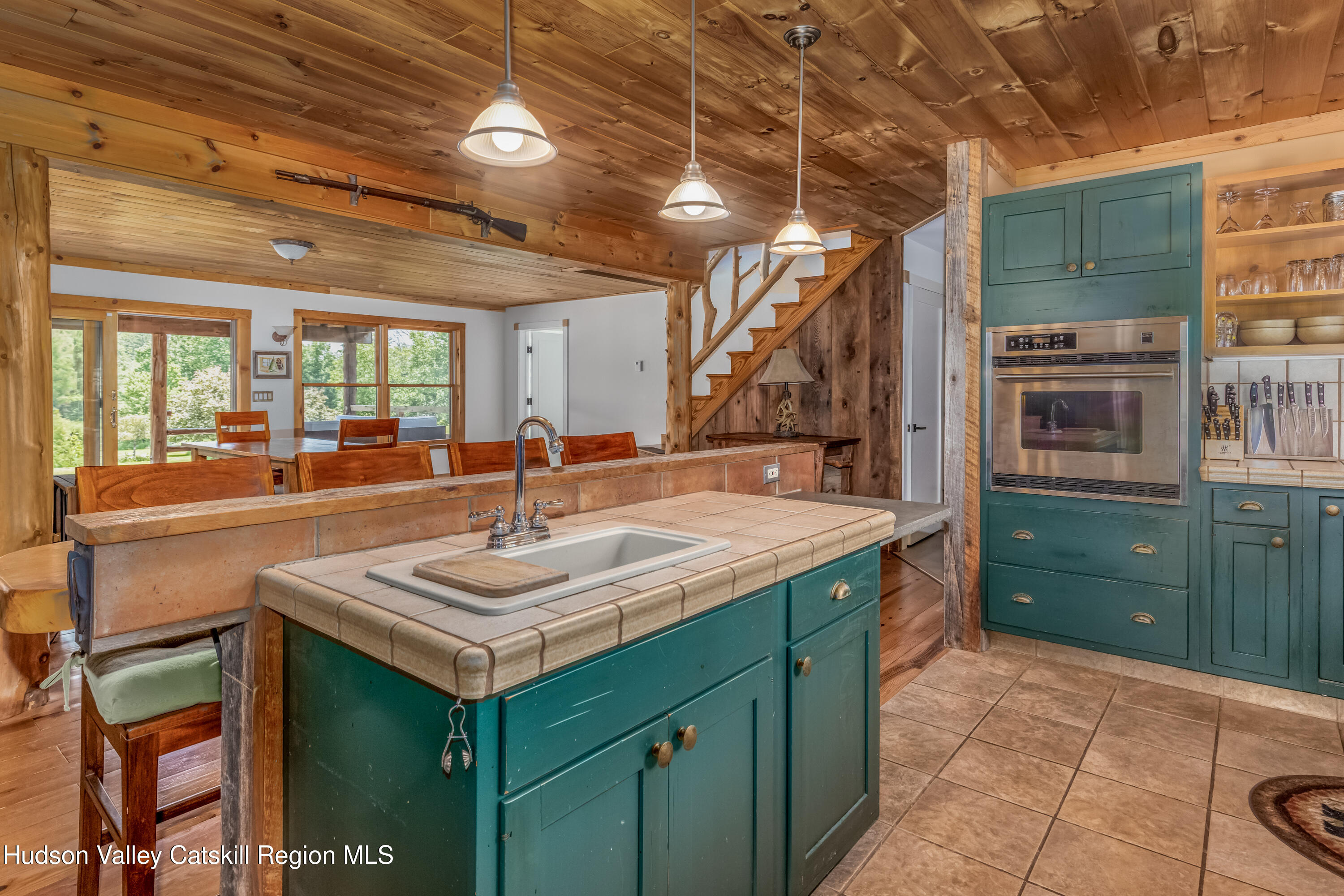 688 Bruce Porn Road Gilboa, NY 12167 - Photo 54 of 104 a kitchen with a sink stove and cabinets