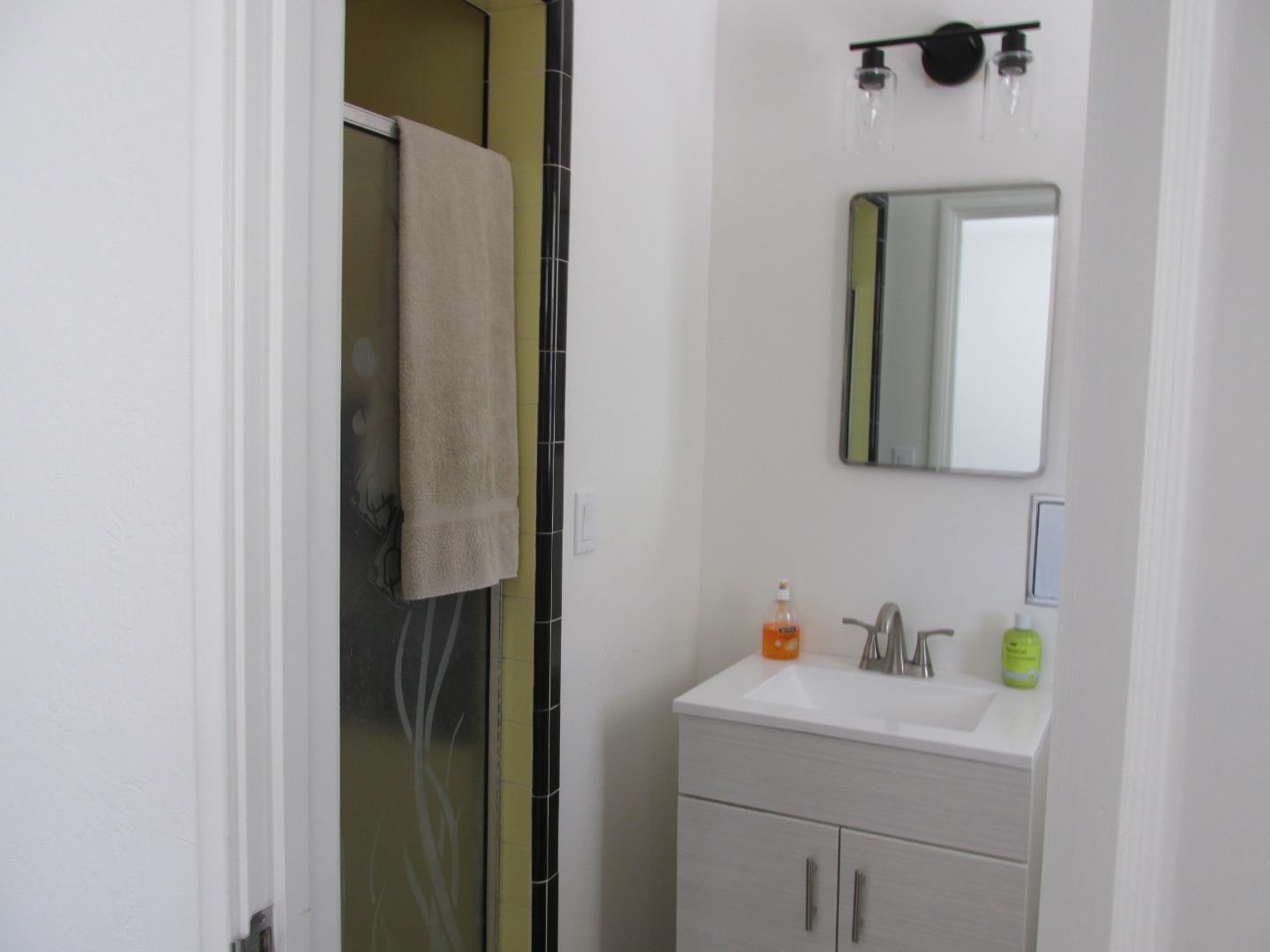 1610 Cienega Road Hollister, CA 95023 - Photo 15 of 35 a bathroom with a sink and a mirror