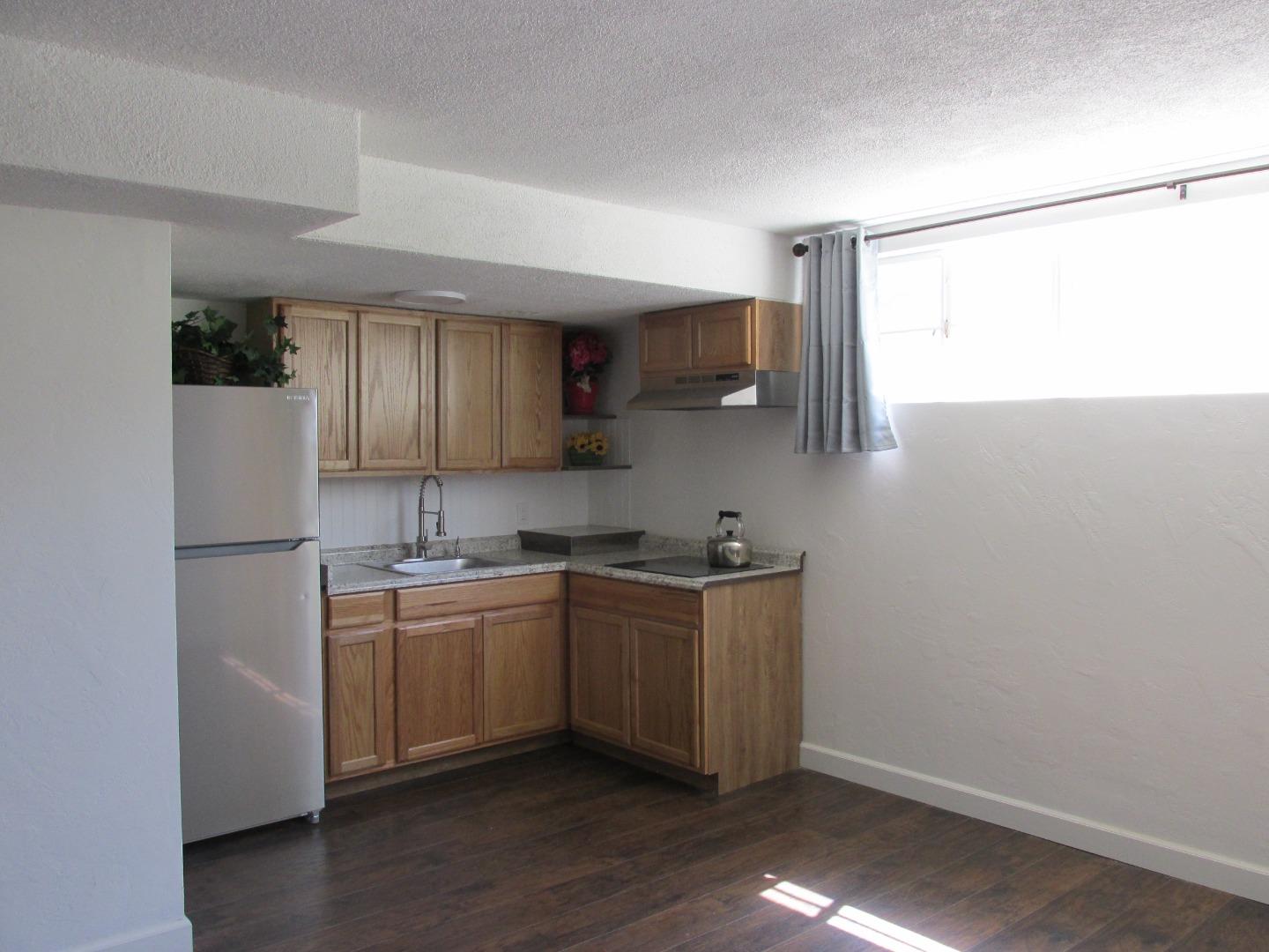 1610 Cienega Road Hollister, CA 95023 - Photo 18 of 35 a kitchen with stainless steel appliances a sink cabinets and a refrigerator