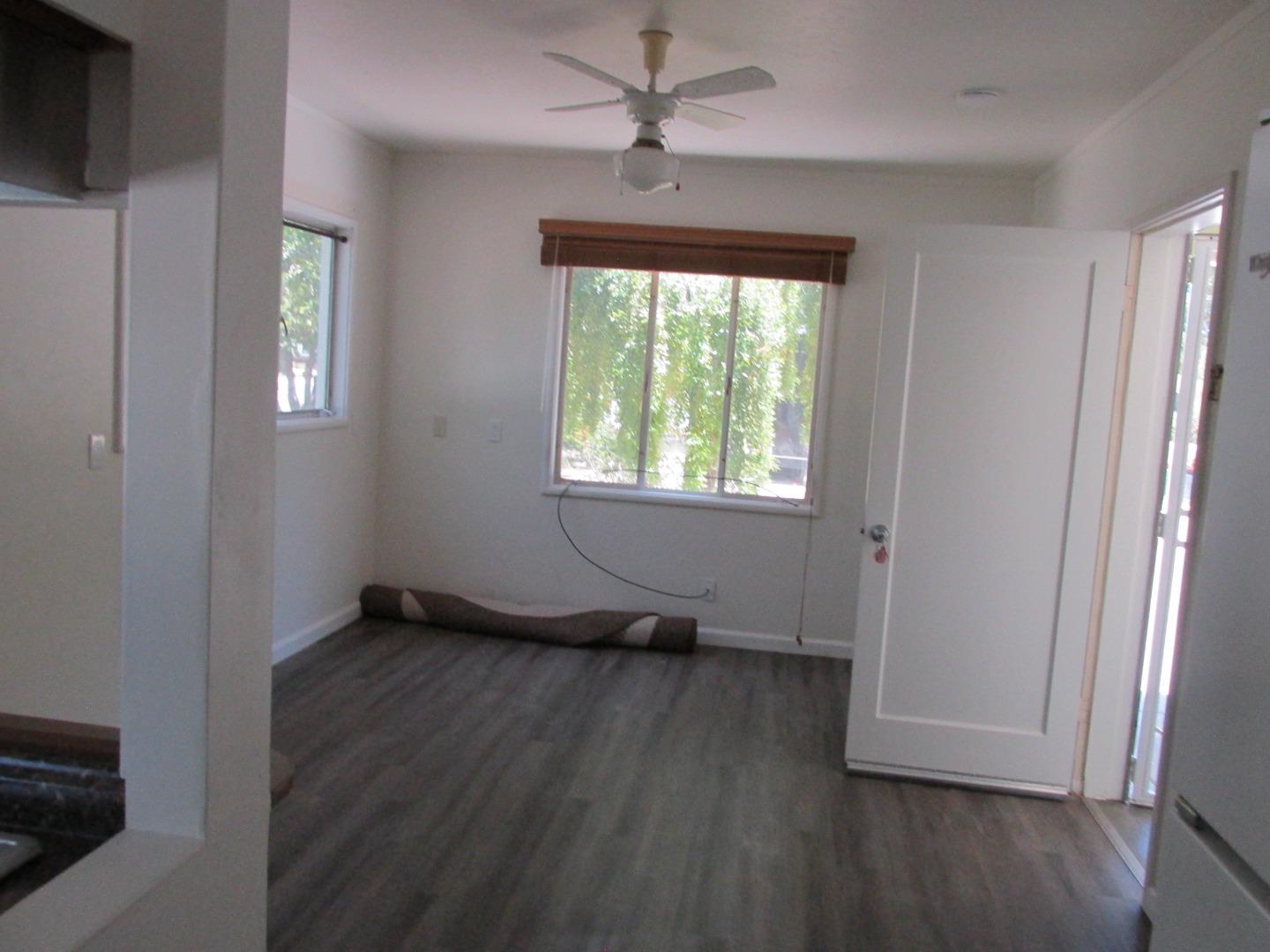 1610 Cienega Road Hollister, CA 95023 - Photo 27 of 35 a view of an empty room with wooden floor and a window