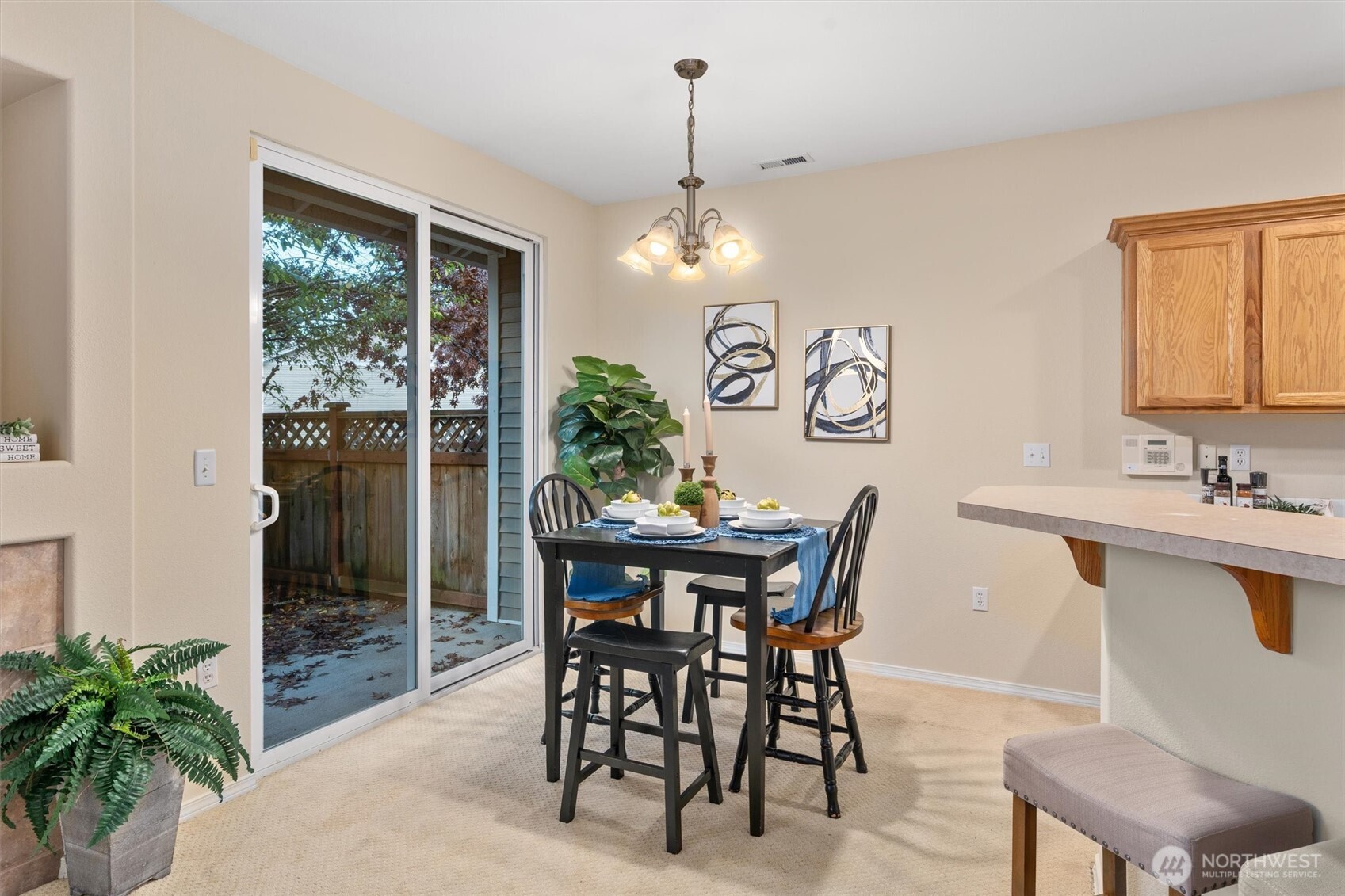 3030 Southeast 12th Street, Unit 1077 Renton, WA 98058 - Photo 11 of 36 a view of a dining room with furniture window and outside view