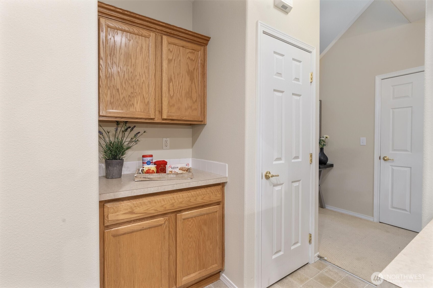 3030 Southeast 12th Street, Unit 1077 Renton, WA 98058 - Photo 17 of 36 a room that has a sink and a stove