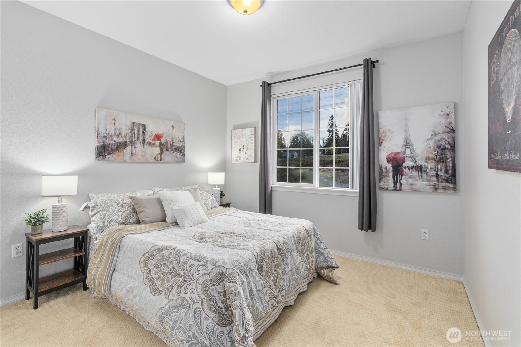 3030 Southeast 12th Street, Unit 1077 Renton, WA 98058 - Photo 24 of 36 a bed room with a bed and a painting on the wall