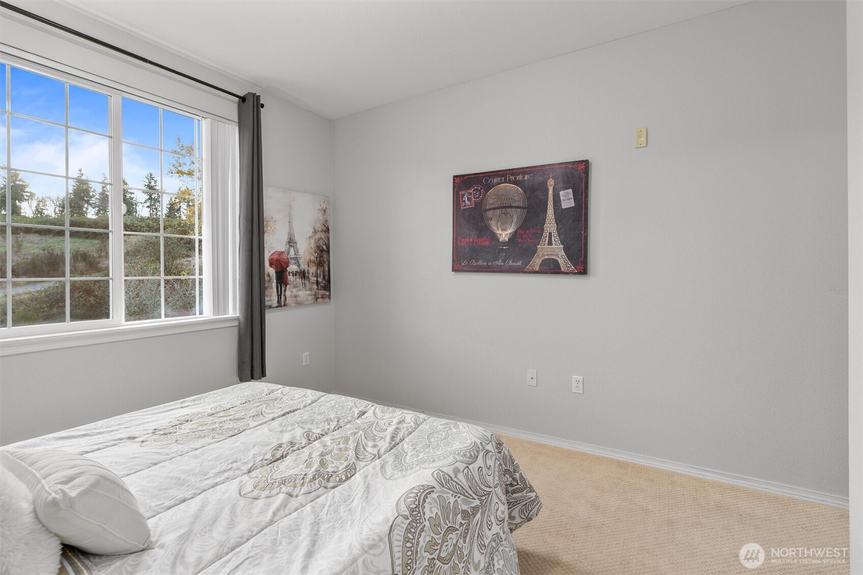 3030 Southeast 12th Street, Unit 1077 Renton, WA 98058 - Photo 25 of 36 a bedroom with a bed and a window
