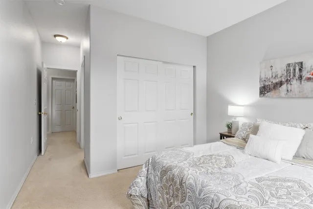 a bedroom with a bed and closet