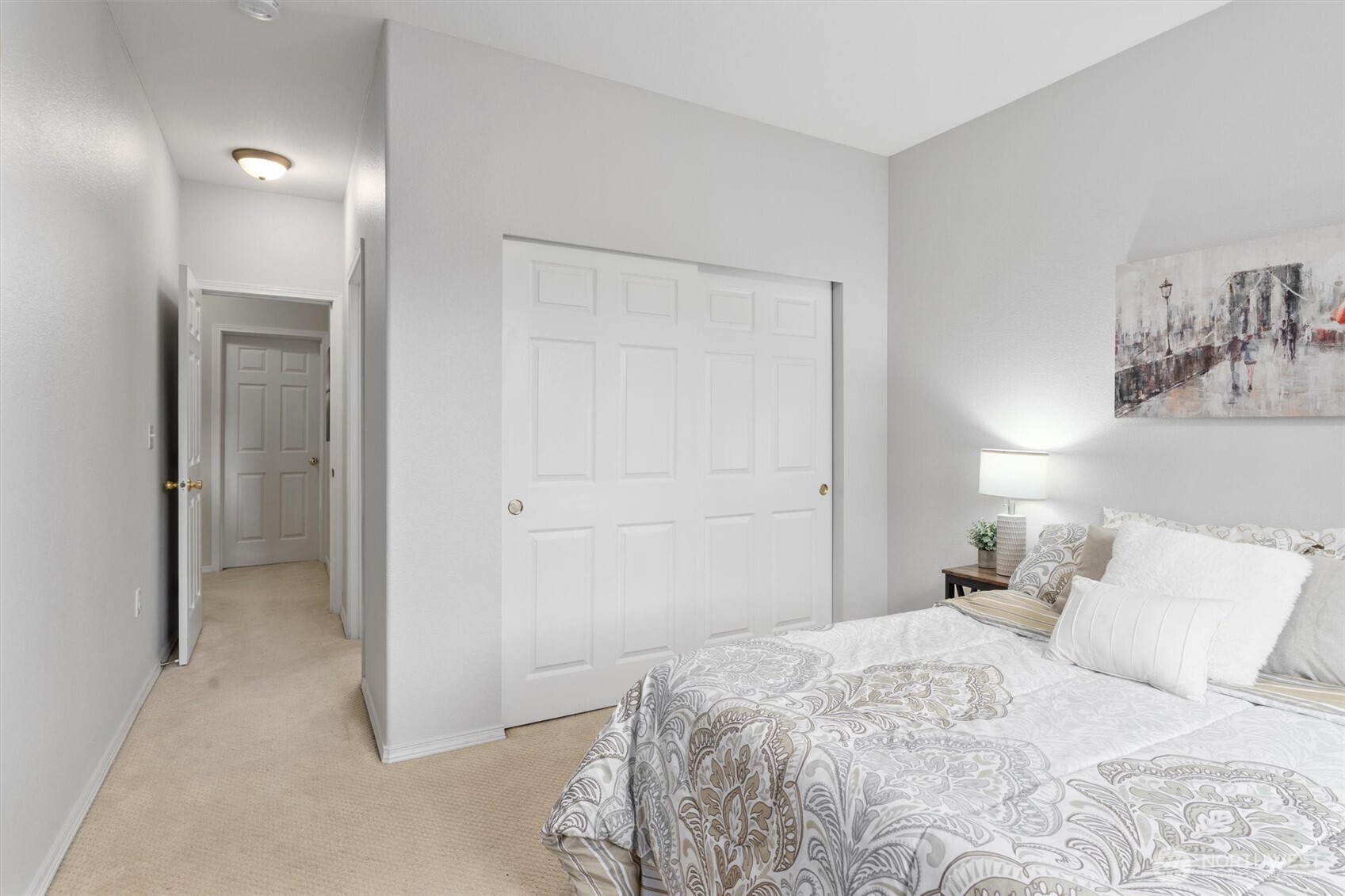 3030 Southeast 12th Street, Unit 1077 Renton, WA 98058 - Photo 26 of 36 a bedroom with a bed and closet