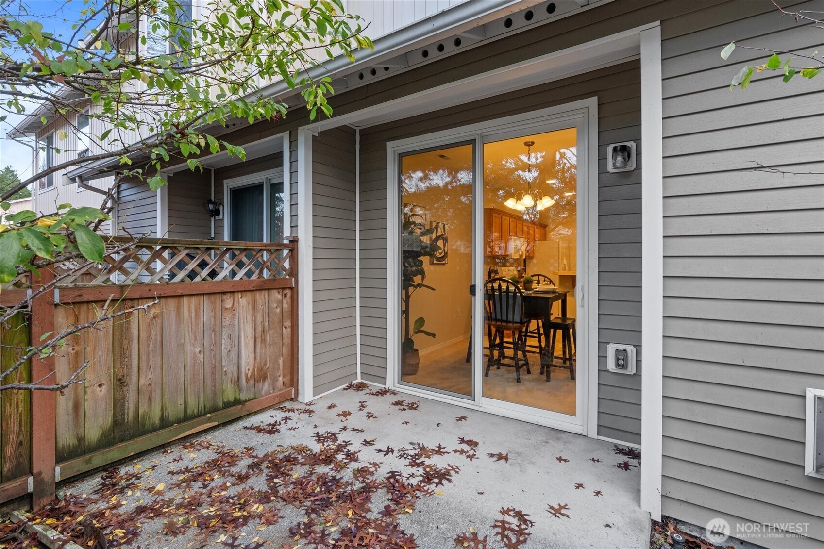 3030 Southeast 12th Street, Unit 1077 Renton, WA 98058 - Photo 32 of 36 a front view of a house with a glass door