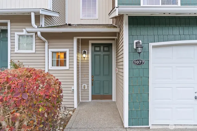 a front view of a house with a garage