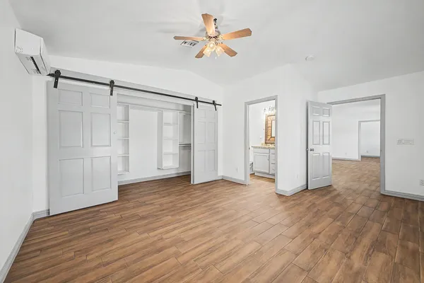 a view of an empty room with a window