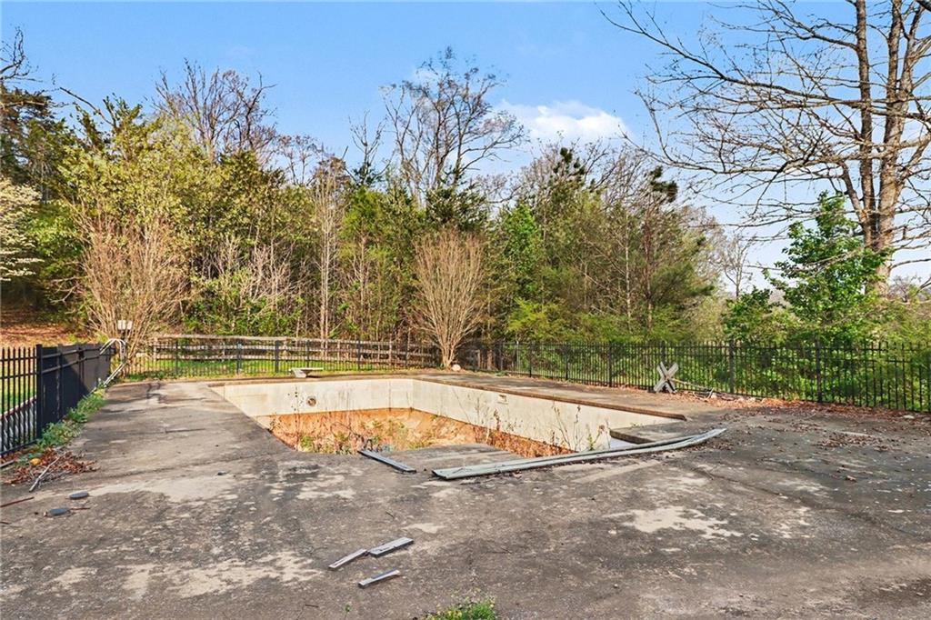 151 Sugar Hill Road Rydal, GA 30171 - Photo 11 of 15 a view of a swimming pool with an outdoor space and seating area