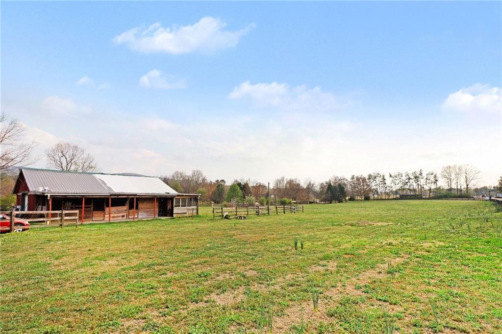151 Sugar Hill Road Rydal, GA 30171 - Photo 6 of 15 a view of an house with backyard and outdoor space