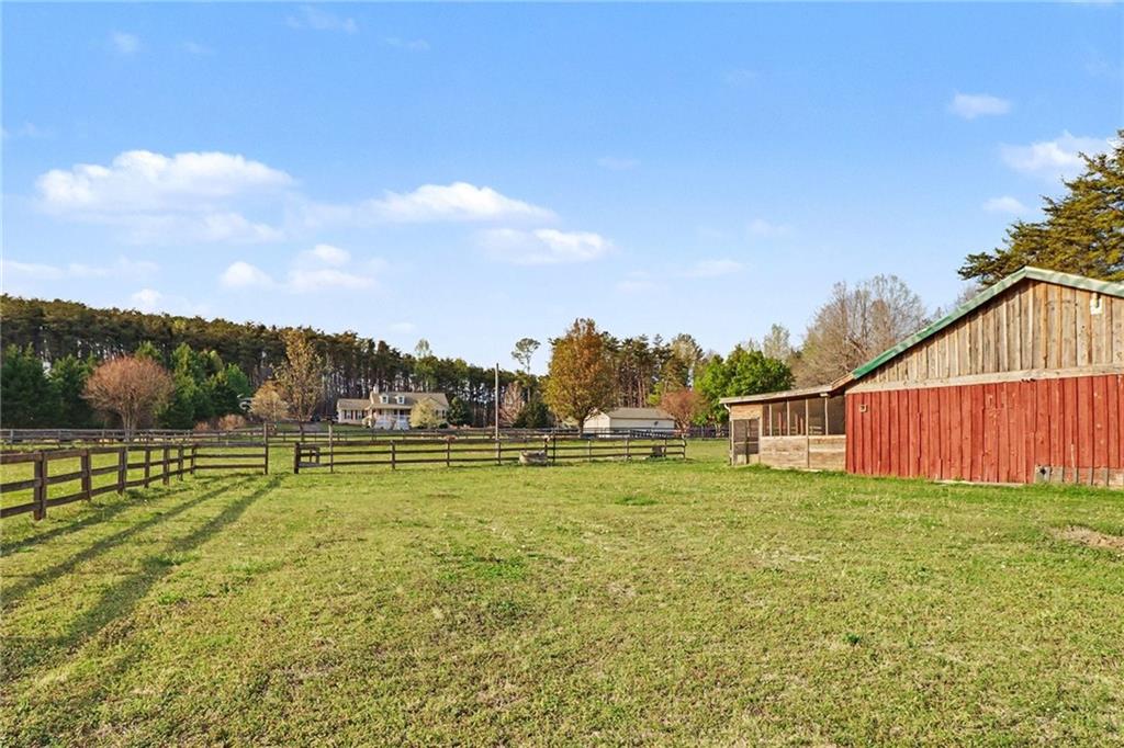 151 Sugar Hill Road Rydal, GA 30171 - Photo 9 of 15 a view of big yard with wooden fence