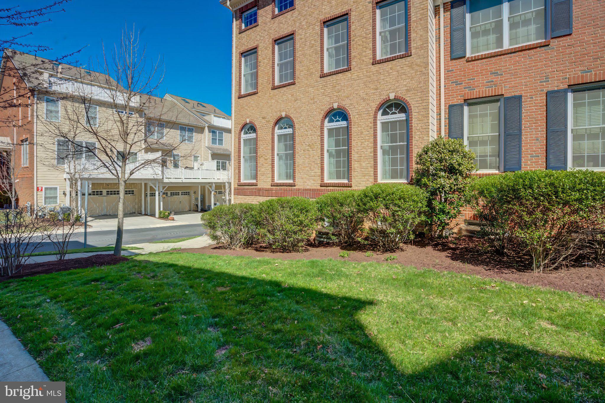 2517 Cherry Tree Road Hanover, MD 21076 - Photo 4 of 61 Charming brick facade with lush greenery.