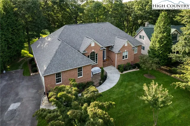 a aerial view of a house with garden and plants