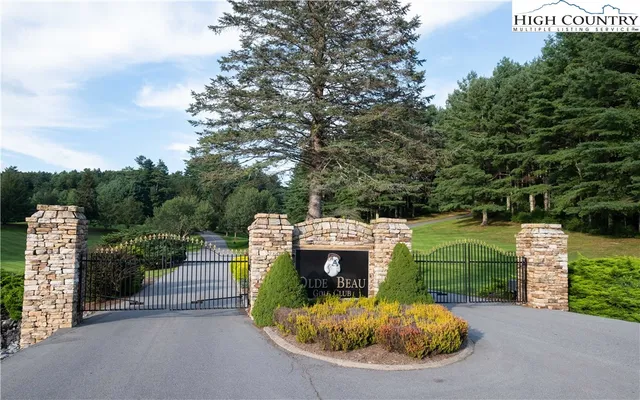 a view of a small house in the middle of a park