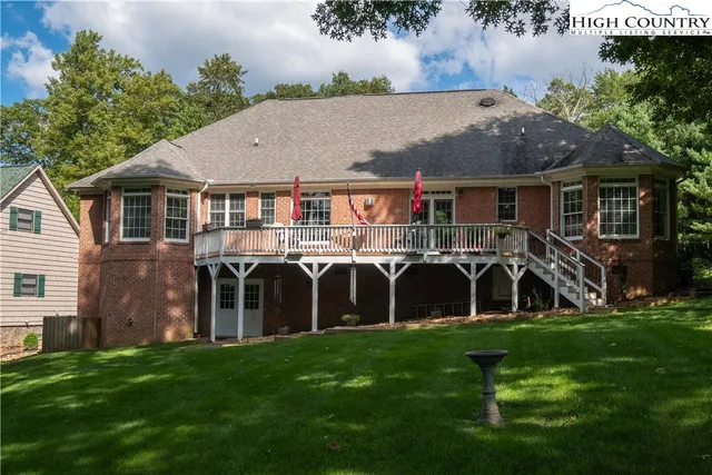 a front view of house with yard and outdoor seating