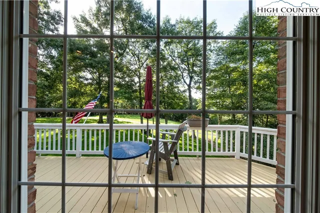a view of a chair and table in the balcony